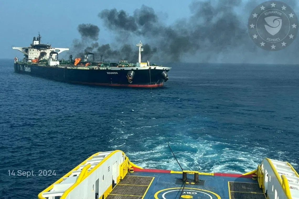 FILE PHOTO: Flames and smoke rise from the damaged Greek-flagged oil tanker MV Sounion, which has been on fire since August 23, after an attack by Houthi militants, on the Red Sea, September 15, 2024 in this handout image. EUNAVFOR ASPIDES/Handout via REUTERS /File Photo