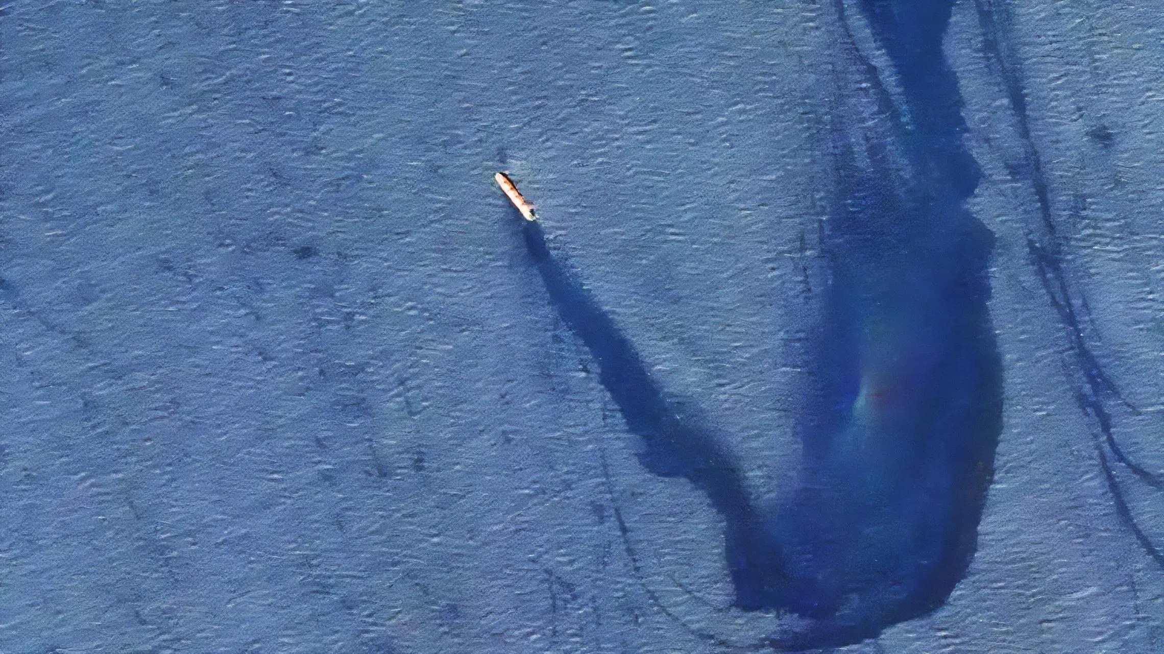 A 2024 image released by the US military shows a bulk carrier slowly taking on water and leaking oil after being hit by Iran-backed Houthi militants in the Red Sea.