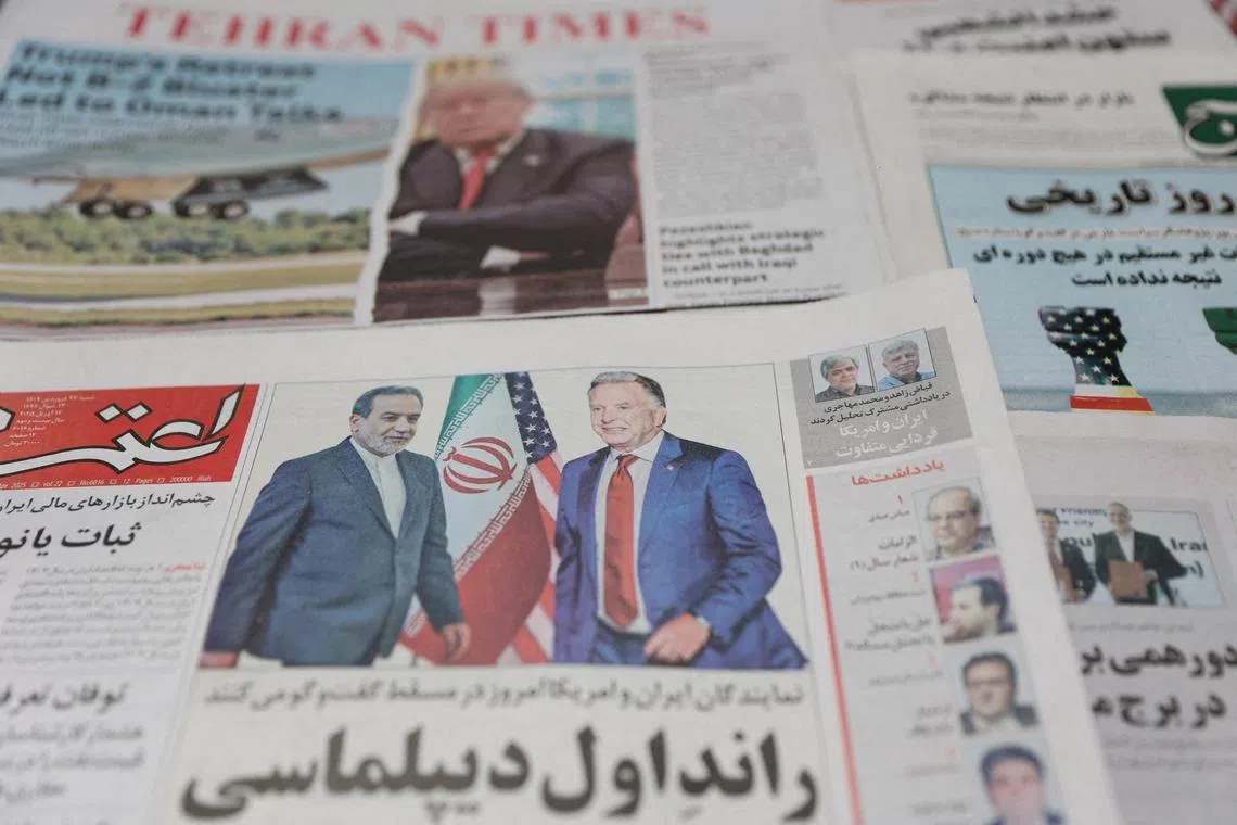 FILE PHOTO: An Iranian newspaper with a cover photo of Iran's Foreign Minister Abbas Araqchi and U.S. Middle East envoy Steve Witkoff, is seen in Tehran, Iran, April 12, 2025. Majid Asgaripour/WANA (West Asia News Agency) via REUTERS/File Photo