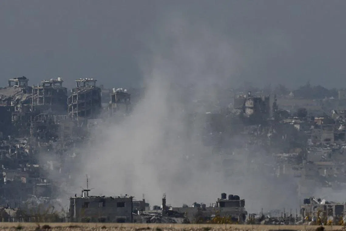 Smoke rises over Gaza, amid the ongoing conflict between Israel and the Palestinian Islamist group Hamas, as seen from southern Israel, December 8, 2023. REUTERS/Amir Cohen