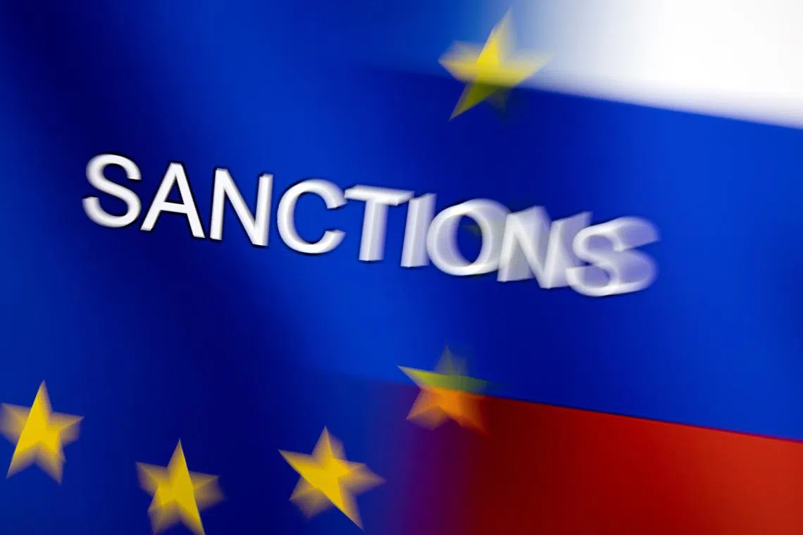 Word \"Sanctions\" is displayed on EU and Russian flags in this illustration taken, February 27, 2022. REUTERS/Dado Ruvic/Illustration/Files