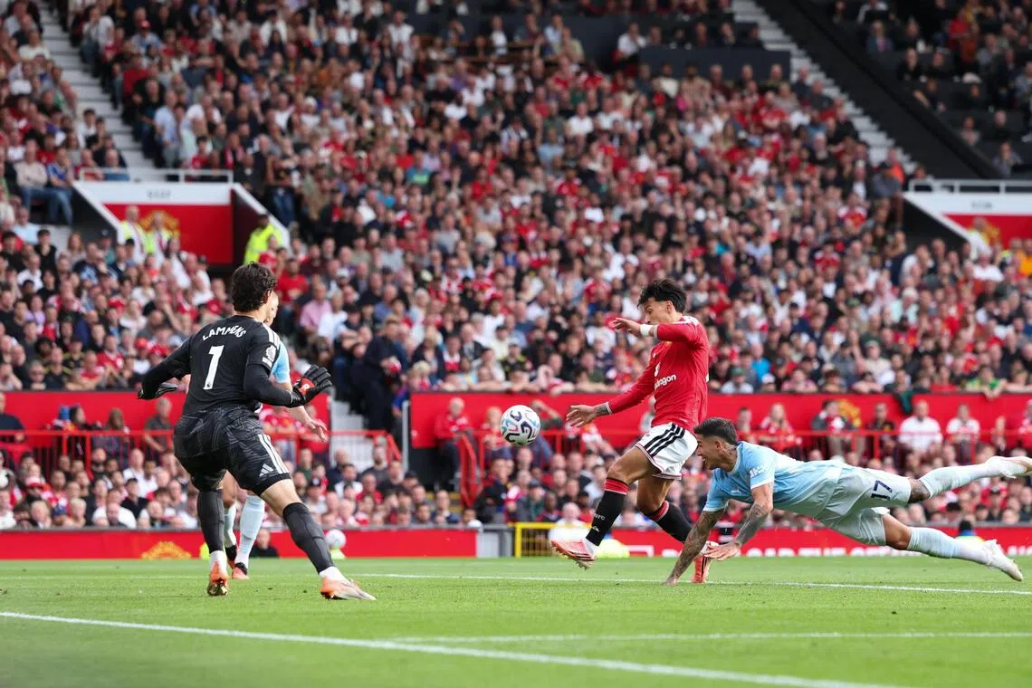 Manchester City’s Enzo Fernandez diving for the ball during the English Premier League match against Manchester United in Manchester, Britain, on Sept 13.