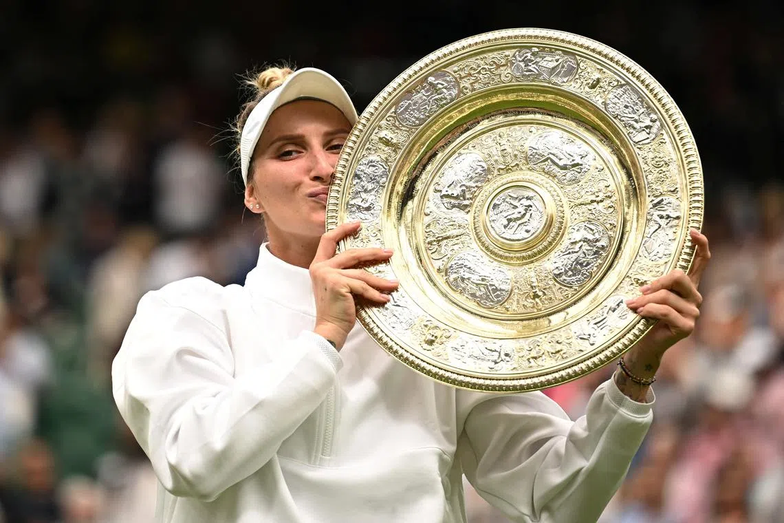 FILE PHOTO: Tennis - Wimbledon - All England Lawn Tennis and Croquet Club, London, Britain - July 15, 2023 Czech Republic's Marketa Vondrousova celebrates with the trophy winning her final match against Tunisia’s Ons Jabeur REUTERS/Dylan Martinez/File Photo