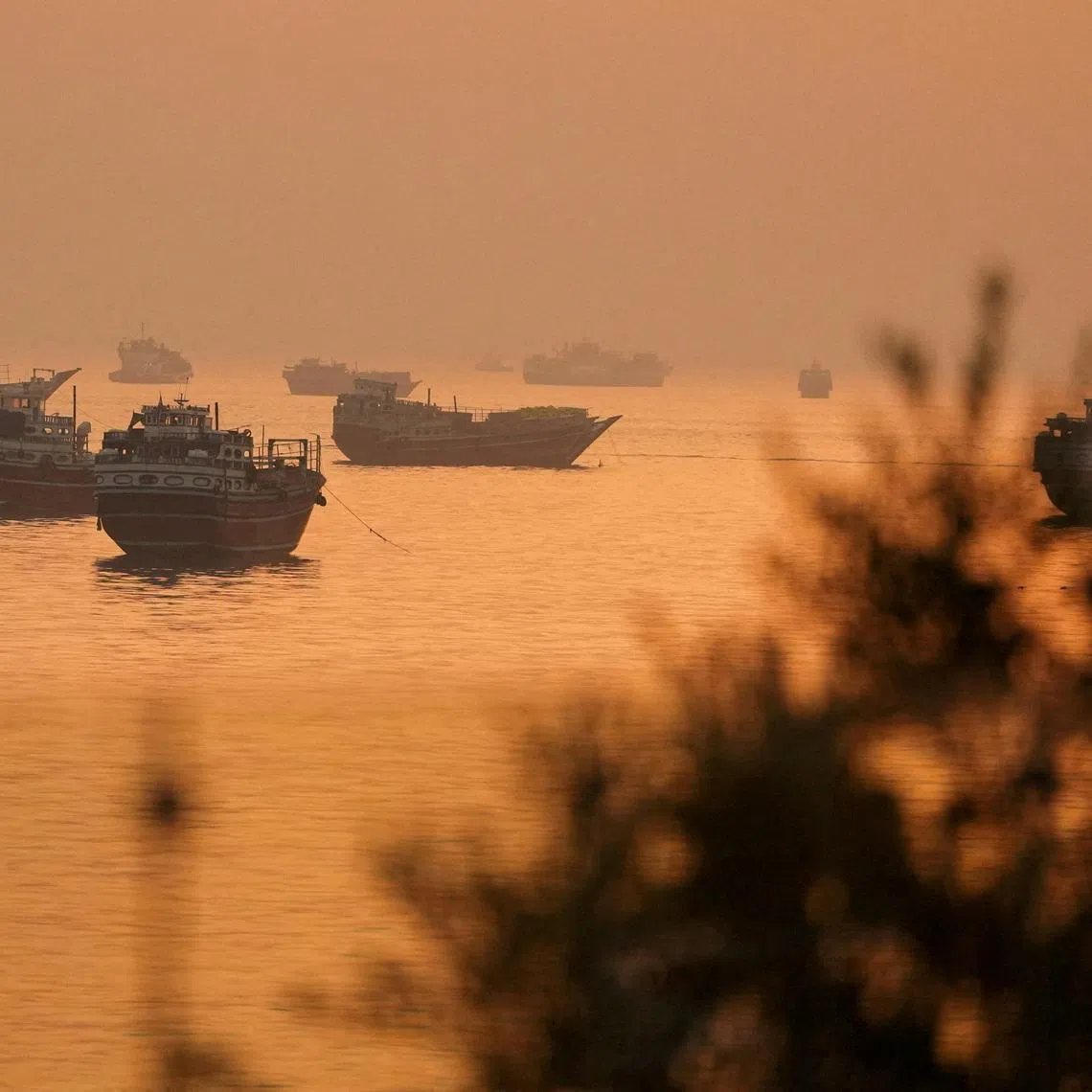 FILE PHOTO: Vessels at the Strait of Hormuz, as seen from Musandam, Oman, June 16, 2026. REUTERS/Stringer/File Photo