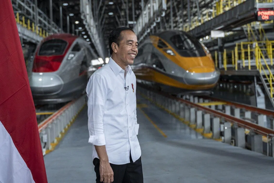 Joko Widodo, Indonesia's president, at Tegalluar station in front of Jakarta-Bandung High-Speed Railway trains in West Java, Indonesia, on Tuesday, Sept. 19, 2023. Indonesia’s outgoing president said Southeast Asia’s largest economy can attain its fastest expansion in three decades under the next leader, who will build on the reforms he’s trying to cement. Photographer: Rosa Panggabean/Bloomberg