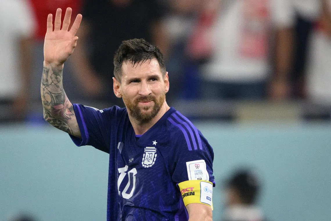 Argentina's captain Lionel Messi waving to fans after their 2-0 win over Poland on Wednesday. 