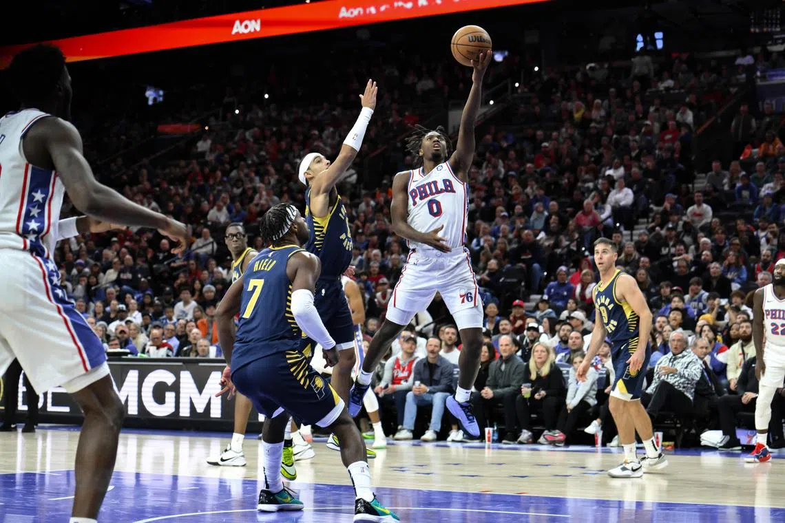 Philadelphia 76ers guard Tyrese Maxey driving past Indiana Pacers guard Andrew Nembhard (No. 2) during the fourth quarter at Wells Fargo Centre. 