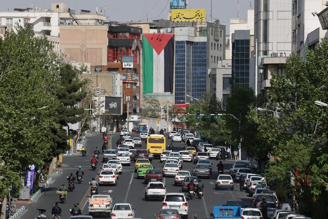 A huge Palestinian flag is seen on a building in a street in Tehran, Iran April 15, 2024. Majid Asgaripour/WANA (West Asia News Agency) via REUTERS