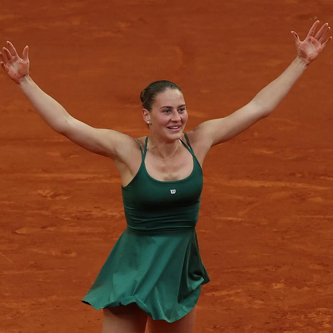 Tennis - Madrid Open - Park Manzanares, Madrid, Spain - May 2, 2026 Ukraine's Marta Kostyuk celebrates winning her final match against Russia's Mirra Andreeva REUTERS/Violeta Santos Moura