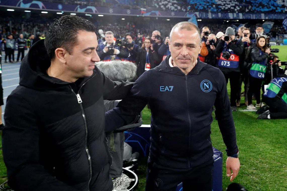 FILE PHOTO: Soccer Football - Champions League - Round of 16 - First Leg - Napoli v FC Barcelona - Stadio Diego Armando Maradona, Naples, Italy - February 21, 2024 FC Barcelona coach Xavi with Napoli coach Francesco Calzona before the match REUTERS/Remo Casilli/File Photo
