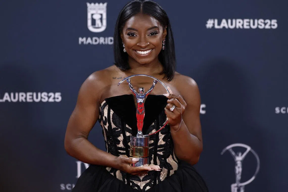 Laureus World Sports Awards - Palacio de Cibeles, Madrid, Spain  - April 21, 2025 United States gymnast Simone Biles poses with the sportswoman of the year award after the ceremony REUTERS/Juan Medina