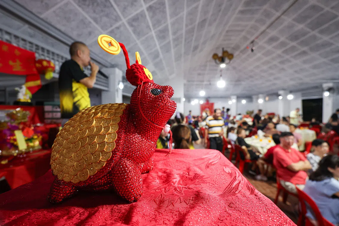 Close-up of an ornamental money bank during a Hungry Ghost Festival dinner auction in Toa Payoh on Aug 23, 2026. It fetched the night’s highest bid of $3000. ST PHOTO: BRIAN TEO