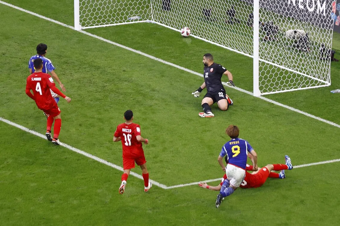 Japan's Ayase Ueda scoring his team's third goal in the Asian Cup last-16 clash with Bahrain.