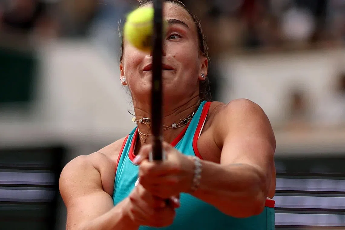 Belarus' Aryna Sabalenka playing a backhand return to US Coco Gauff during their women's singles final match of the French Open tennis tournament on Court Philippe-Chatrier at the Roland-Garros Complex in Paris, on June 7, 2025.