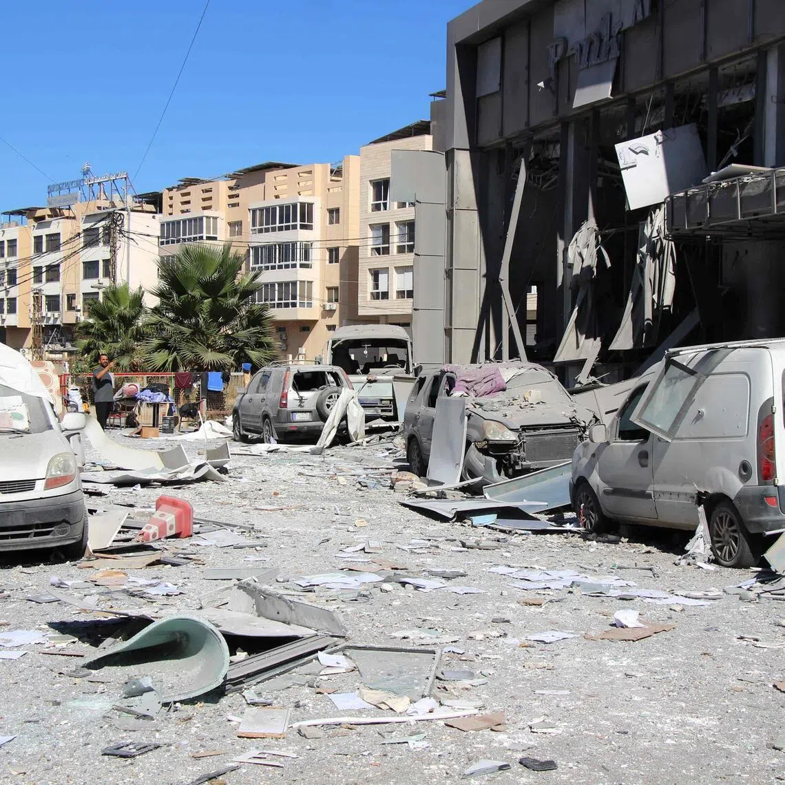 A man inspects the aftermath at the site of an Israeli strike that hit the previous day in the southern Lebanese coastal city of Tyre on June 5.