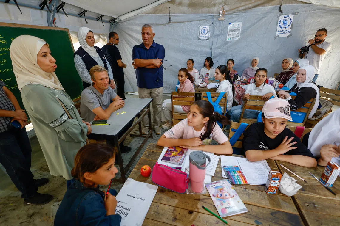 Carl Skau, Acting Executive Director of the World Food Programme (WFP), visits a school in Deir Al-Balah, in the central Gaza Strip October 18, 2026. REUTERS/Mahmoud Issa