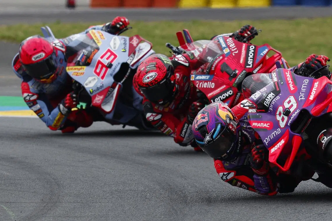 FILE PHOTO: MotoGP - French Grand Prix - Bugatti Circuit, Le Mans, France - May 12, 2024 Prima Pramac Racing's Jorge Martin in action as he leads the MotoGP race ahead of Ducati Lenovo Team's Francesco Bagnaia and Gresini Racing MotoGP's Marc Marquez   Prima Pramac Racing's Jorge Martin reacts as he crosses the line to win the MotoGP French Grand Prix REUTERS/Gonzalo Fuentes/File Photo