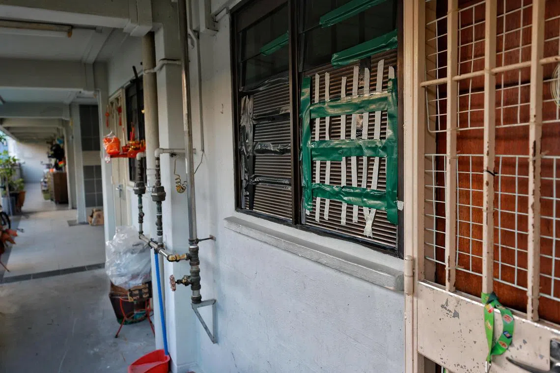 The taped-up window louvres of a rental unit in Ang Mo Kio where a resident was accused of abandoning 40 cats inside.