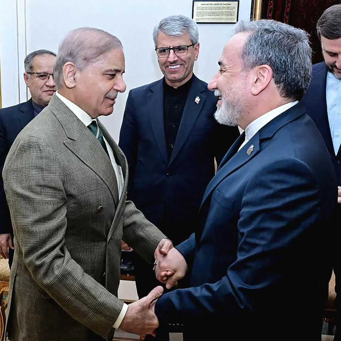 Pakistani Prime Minister Shehbaz Sharif (left) greeting Iranian Foreign Minister Abbas Araghchi before their meeting in Islamabad on April 25. Mr Araqchi flew out of the Pakistani capital following their talks.
