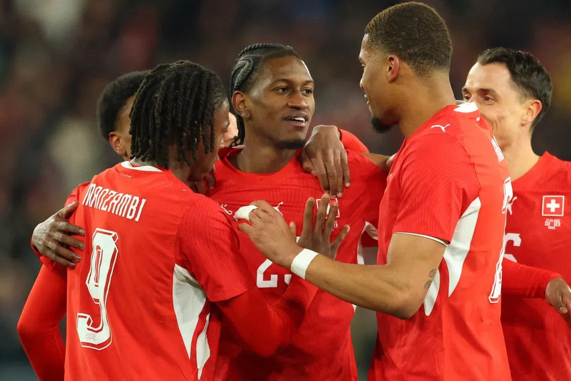 FILE PHOTO: Soccer Football - International Friendly - Switzerland v Germany - St. Jakob-Park, Basel, Switzerland - March 27, 2026 Switzerland's Joel Almada Monteiro celebrates scoring their third goal with teammates REUTERS/Denis Balibouse/File Photo