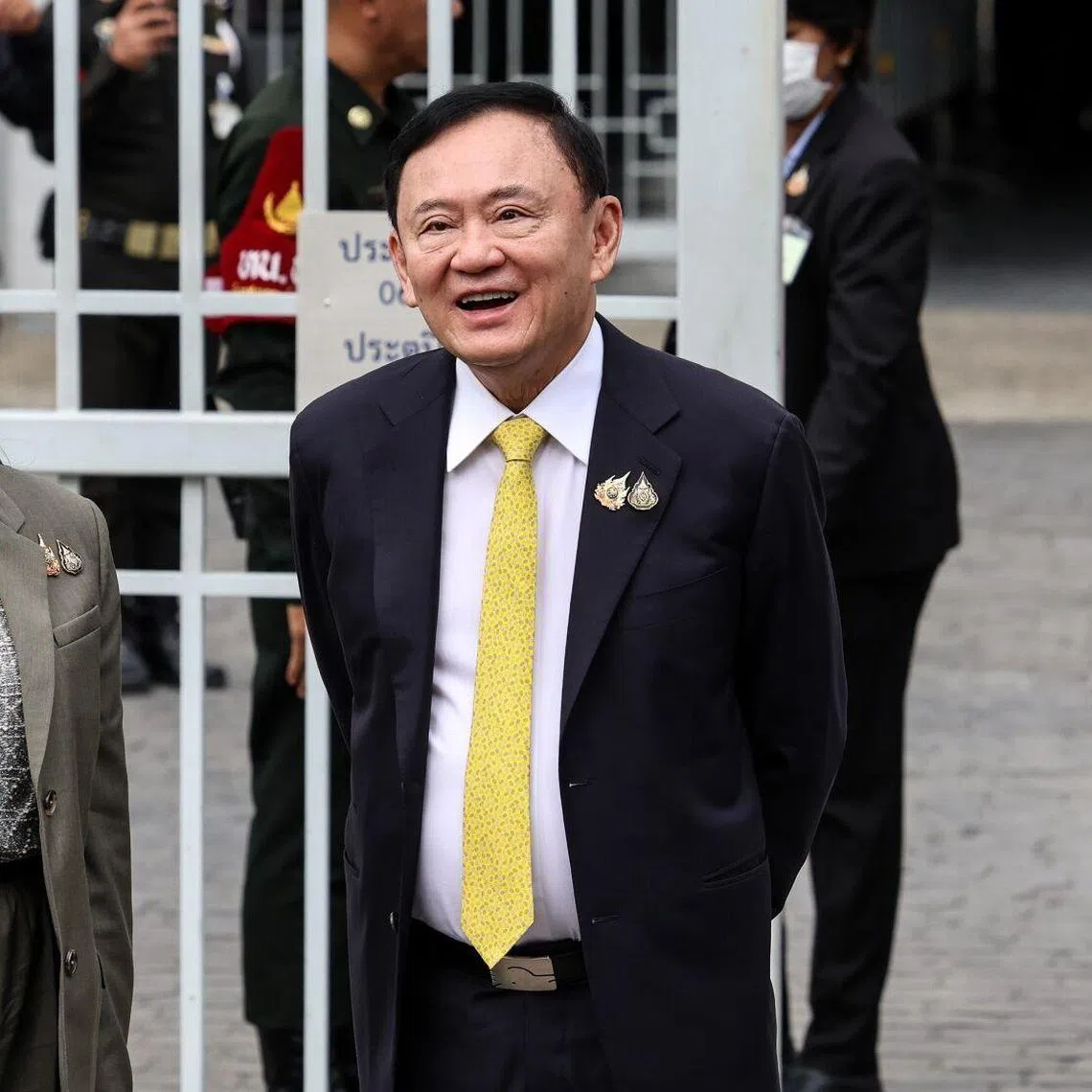 Thailand's former prime minister Thaksin Shinawatra (right) and his daughter Paetongtarn Shinawatra  arrive at the Supreme Court in Bangkok, Thailand.