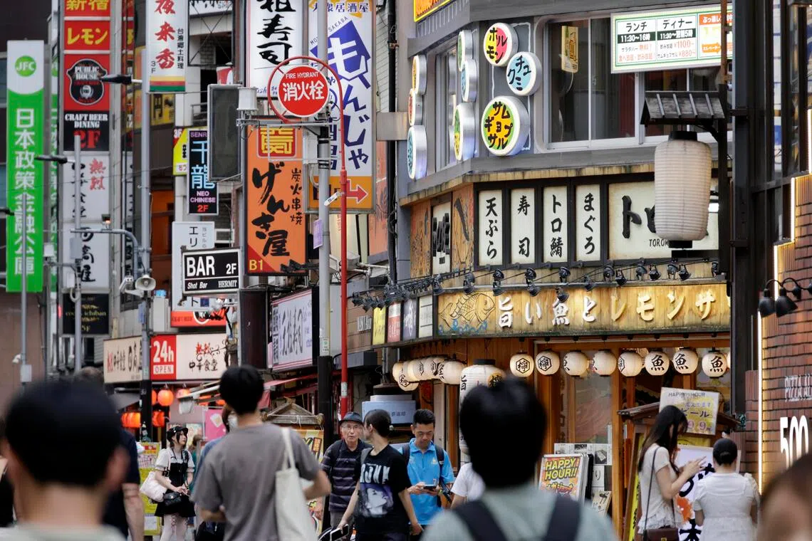 epa13175439 People walk through a shopping street in the Shinjuku commercial, business and entertainment district in Tokyo, Japan, 17 August 2026. Japan's GDP grew at an annualized rate of 1.1 percent in the April-June period from the previous three months, marking the third consecutive quarter of growth. Meanwhile, private consumption fell 0.02 percent from the previous three-month period.  EPA/FRANCK ROBICHON