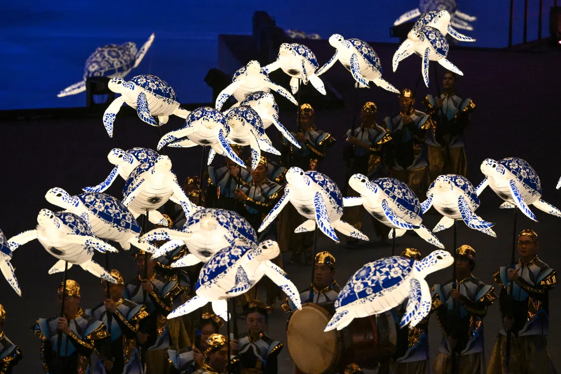 ST20260809-202658800474-Lim Yaohui-pixndp2026/ Performers from Soka Gakkai Singapore performing alongside marine animal puppets during Chapter 3 of National Day Parade 2026 at the National Stadium on Aug 9, 2026. (ST PHOTOS: LIM YAOHUI)