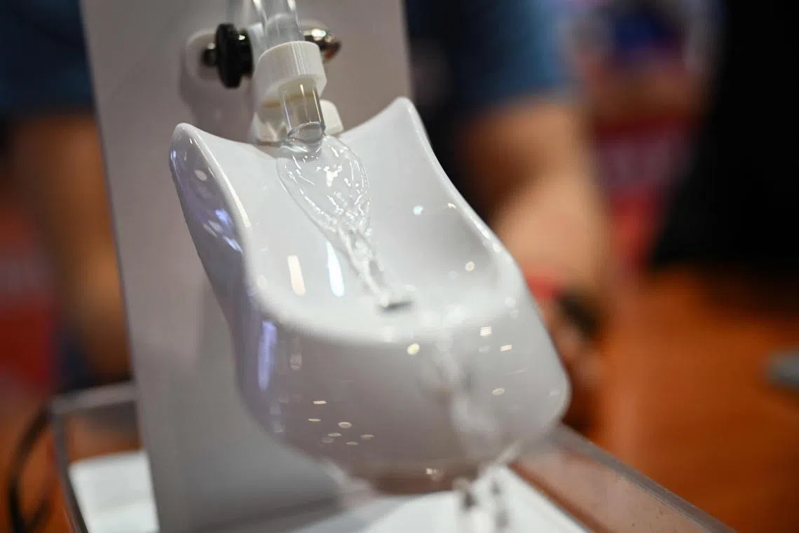 Starling Mexican UrinDx toilet urinalysis tester to check pee for urinary tract infections, demonstrated at the CES in Las Vegas, on Jan 7.