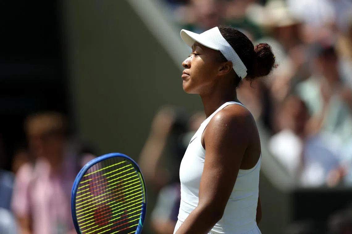 Tennis - Wimbledon - All England Lawn Tennis and Croquet Club, London, Britain - July 4, 2025 Japan's Naomi Osaka looks dejected after losing her third round match against Russia's Anastasia Pavlyuchenkova REUTERS/Isabel Infantes