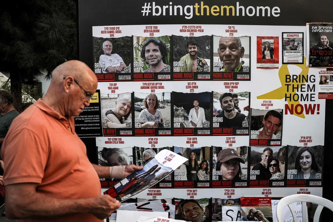 A wall identifying hostages held by Palestinian militants since the Oct 7 attack is seen in Tel Aviv on Oct 28.