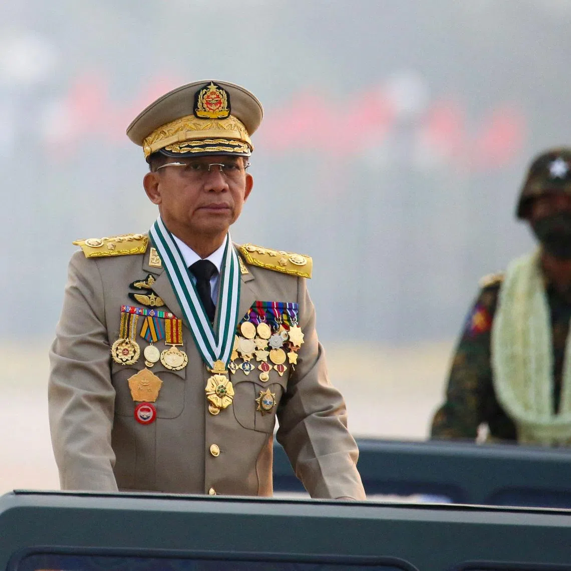 FILE PHOTO: Myanmar's junta chief Senior General Min Aung Hlaing, who ousted the elected government in a coup on February 1, presides an army parade on Armed Forces Day in Naypyitaw, Myanmar, March 27, 2021. REUTERS/Stringer/File Photo