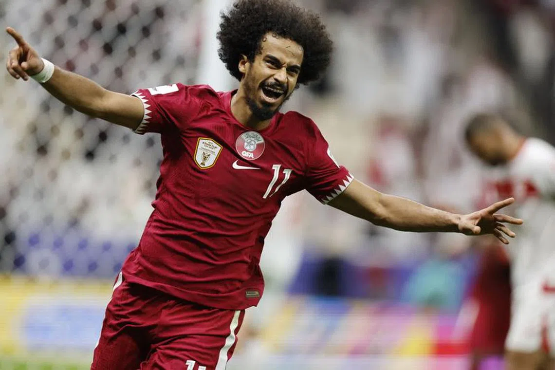 Soccer Football - AFC Asian Cup - Group A - Qatar v Lebanon - Lusail Stadium, Lusail, Qatar - January 12, 2024 Qatar's Akram Afif celebrates scoring their third goal REUTERS/Thaier Al-Sudani