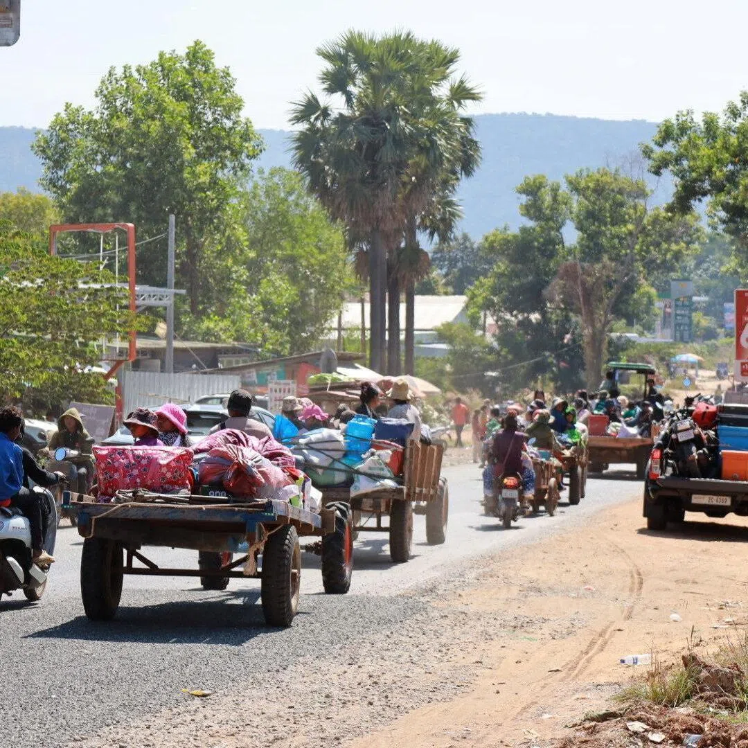 People flee amid clashes between Thailand and Cambodia along a disputed border area, in Oddar Meanchey Province, Cambodia, Dec 8, 2025.
