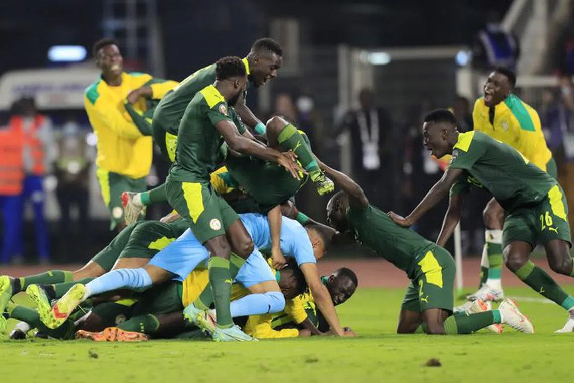 Soccer Football - Africa Cup of Nations - Final - Senegal v Egypt - Olembe Stadium, Yaounde, Cameroon - February 6, 2022 Senegal's Sadio Mane celebrates with teammates after scoring the winning penalty in the shoot out. Reuters/File photo