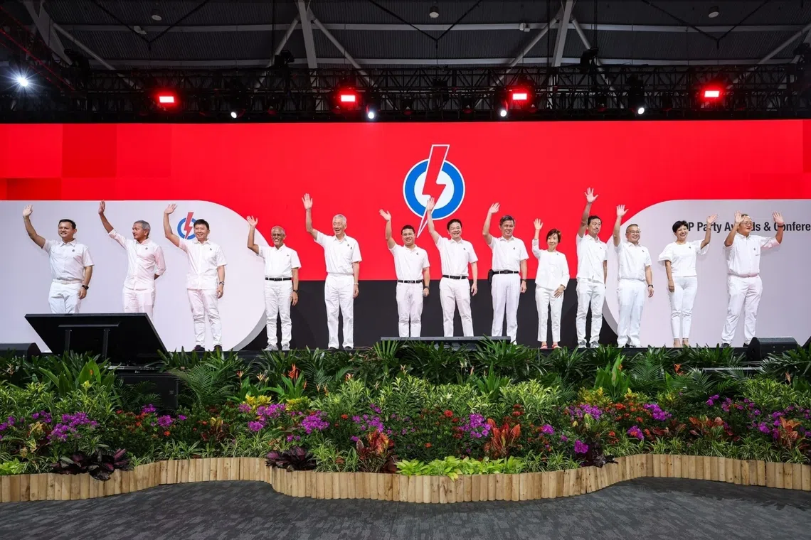 (From left) PAP’s 39th CEC consisting of Zaqy Mohamad, Vivian Balakrishnan, Chee Hong Tat, Masagos Zulkifli, Lee Hsien Loong, Desmond Lee, Lawrence Wong, Chan Chun Sing, Grace Fu, Ong Ye Kung, Edwin Tong, Indranee Rajah, and Tan See Leng, at the PAP Awards and Conference at Singapore Expo on Oct 25.