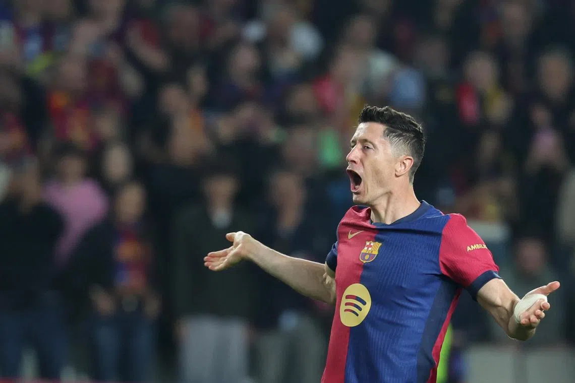 Barcelona's Robert Lewandowski celebrates scoring his team's second goal.