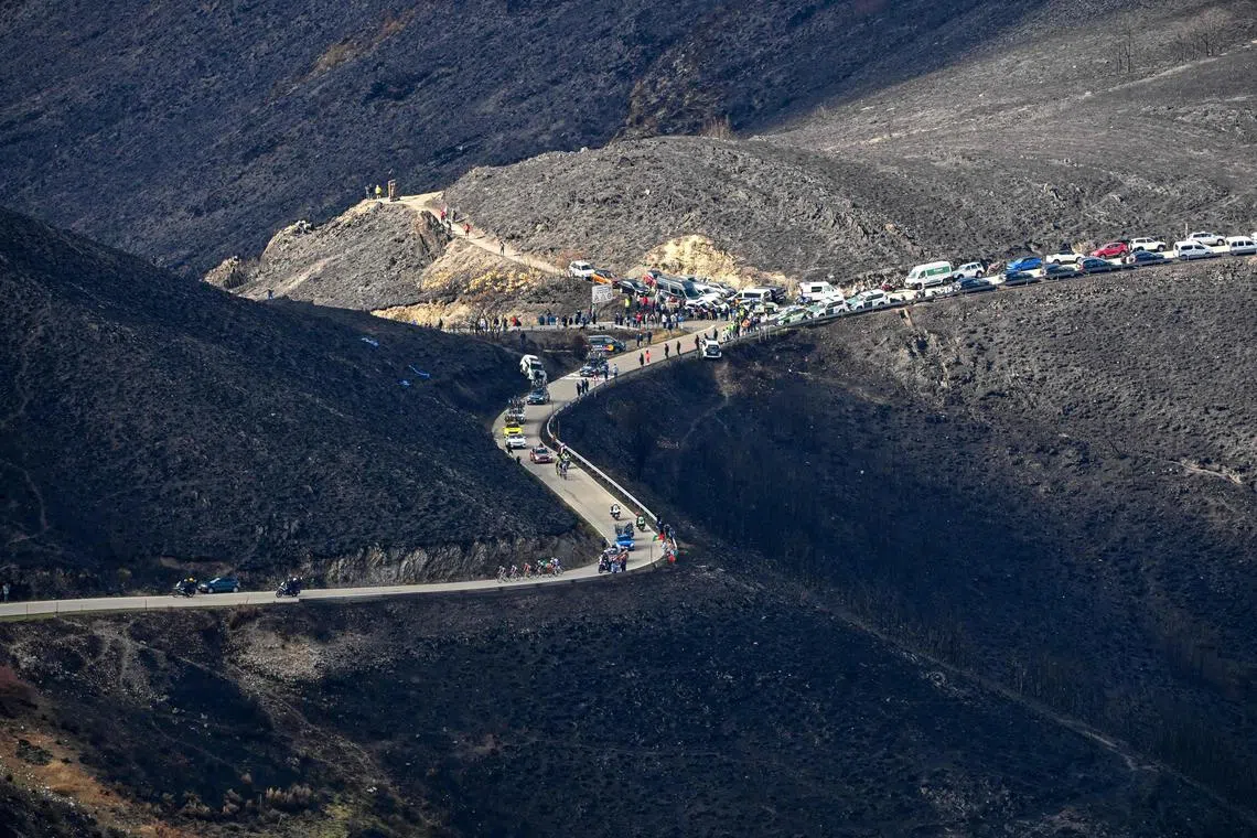Race leaders make their up the Morredero pass which was charred in recent forest fires during the 17th stage of the Vuelta a Espana.