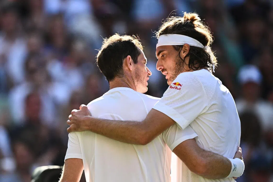 Greece's Stefanos Tsitsipas (right) hugs Britain's Andy Murray after their second-round match.