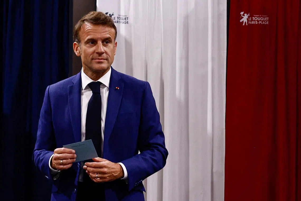FILE PHOTO: French President Emmanuel Macron visits a polling station to vote in the first round of the early French parliamentary elections, in Le Touquet-Paris-Plage, France, June 30, 2024. REUTERS/Yara Nardi/Pool/File Photo