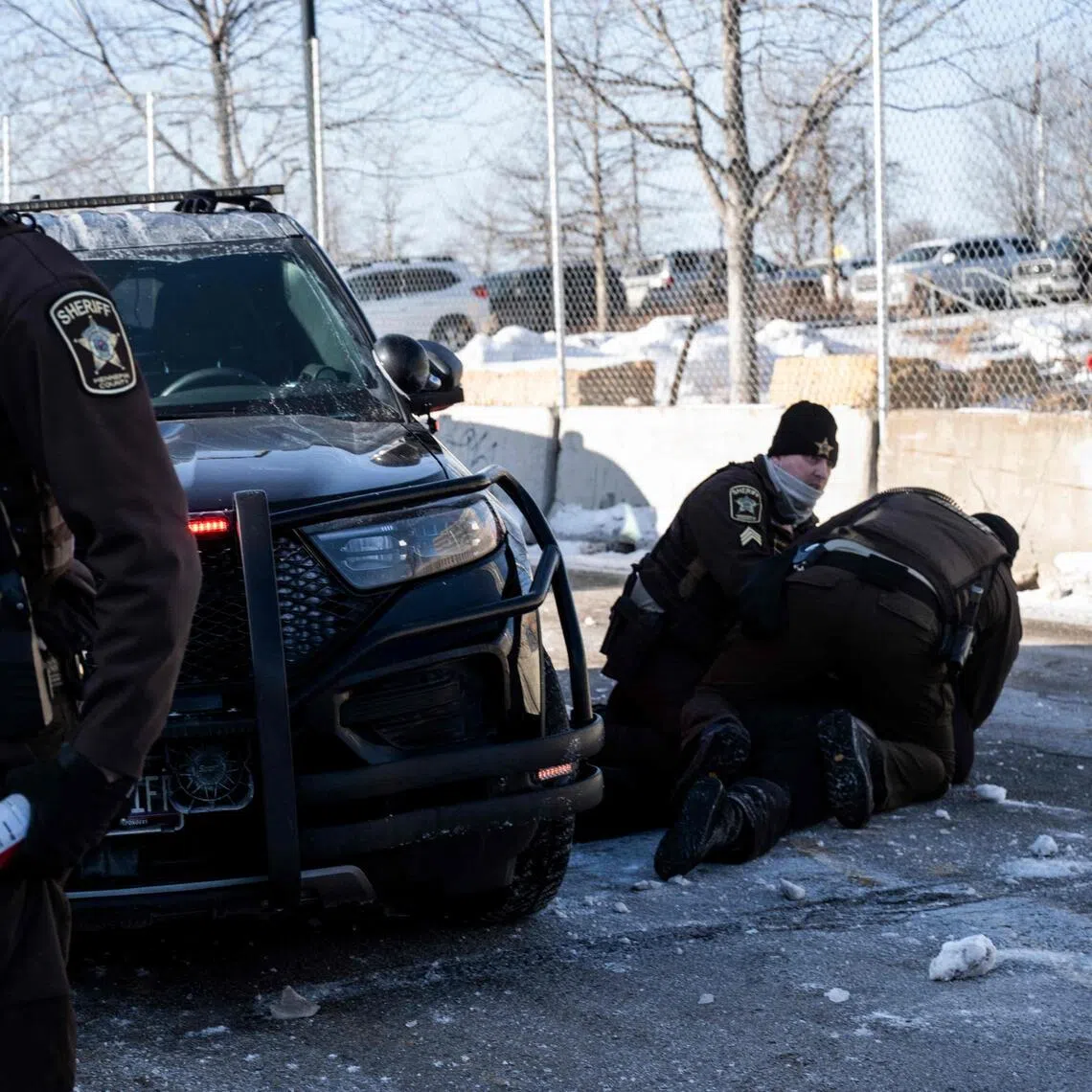 An activist being arrested by police in Minneapolis on Jan 23, after protesters attempted to block a street in front of the Bishop Henry Whipple Federal Building.