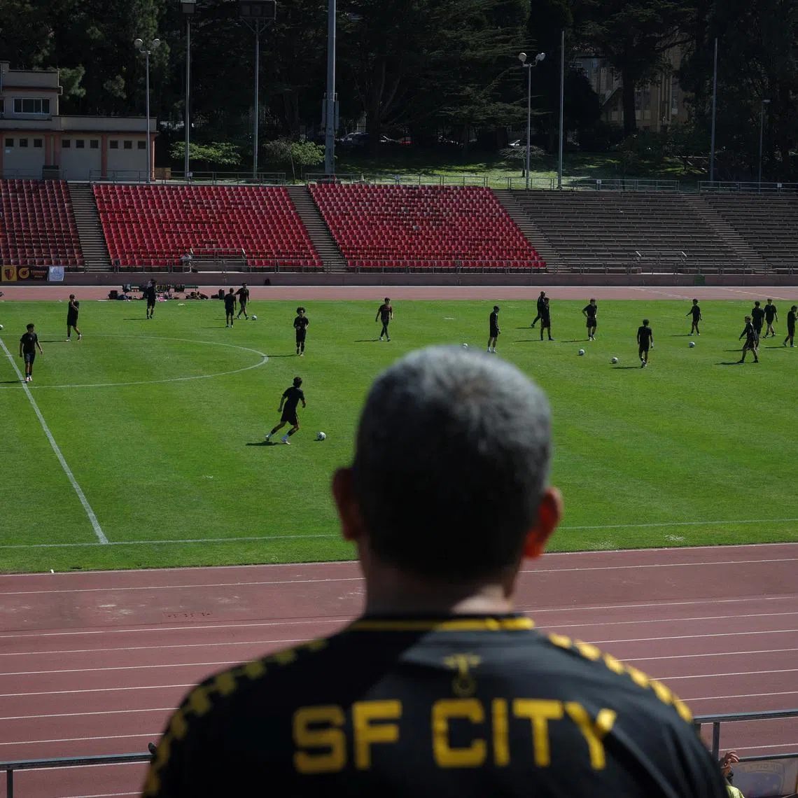 A fan watches a game between FC Davis and San Francisco City FC at the Kezar Stadium in San Francisco, California, U.S., May 17, 2026. REUTERS/Carlos Barria