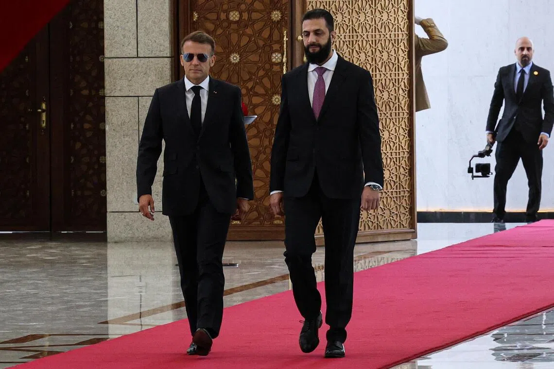 epa13093846 French President Emmanuel Macron is greeted by Syrian President Ahmad al-Sharaa at the Presidential Palace in Damascus, Syria, 07 July 2027. The French president is the first head of state from a European Union country to visit Syria since the fall of the Assad regime.  EPA/MOHAMED AL RIFAI