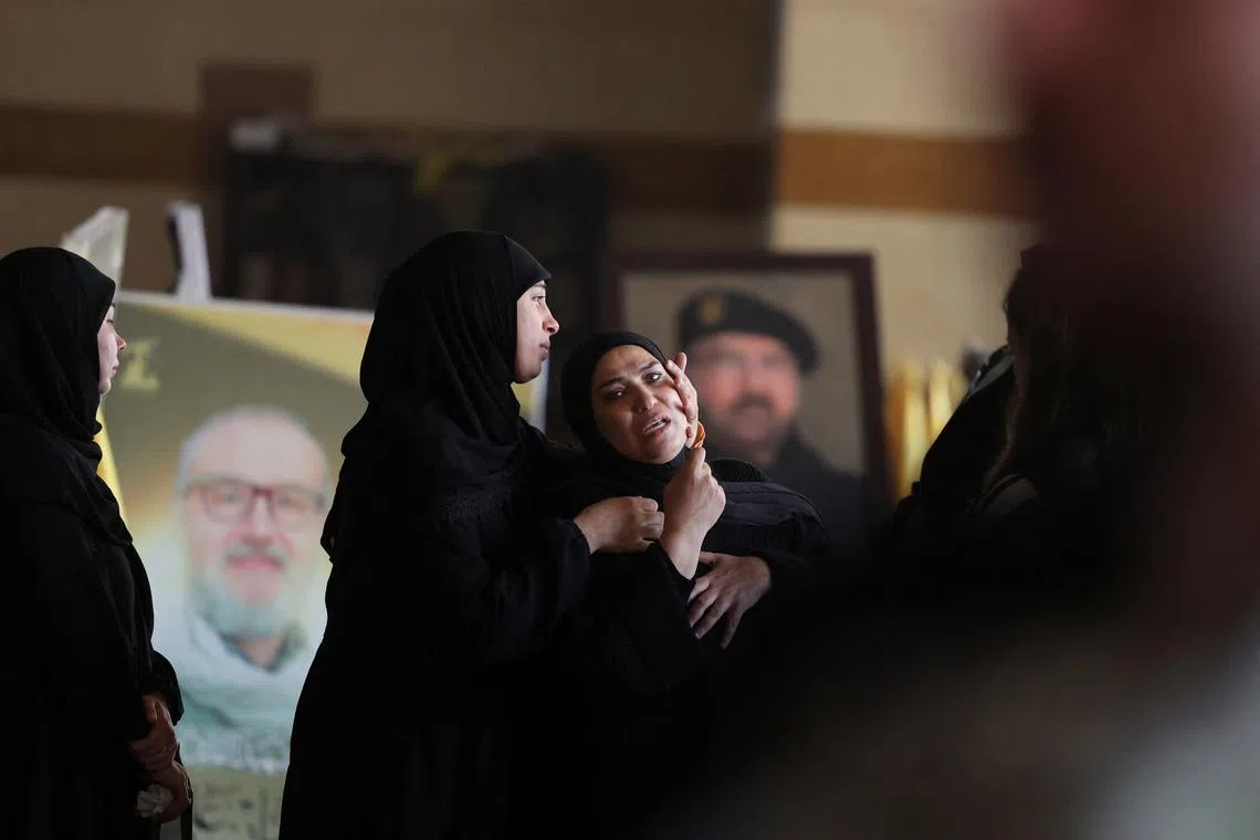 FILE PHOTO: Women mourn during the funeral of Ghassan Najjar, a cameraman at Al Mayadeen news outlet who was killed in an Israeli strike with two other journalists in the southern Lebanese town of Hasbaya, in Beirut’s southern suburbs, Lebanon October 26, 2024. REUTERS/Mohamed Abd El Ghany/File Photo