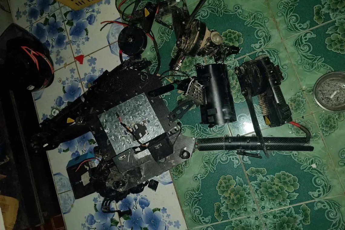 Debris reportedly belonging to a drone, which was shot down by Myanmar resistance fighters, is pictured in southeastern Myanmar, in this handout picture released June 11, 2024. Angry Bird Drone Rangers/Handout via REUTERS