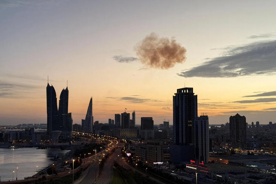 Smoke rises after an Iranian drone was intercepted over the Bahrain Financial Harbour towers, in Manama, on March 6. 