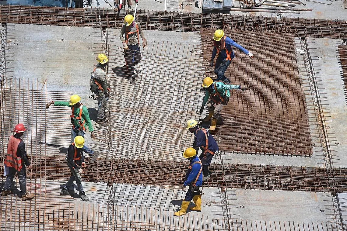 Pixheat/ pixgeneric / generic picture of 
Construction workers working under sweltering heat at Dakota One BTO construction site on 12 May 2023 . 
Current daily max temp is 36.2 deg C, possibly highest temp of the year so far.