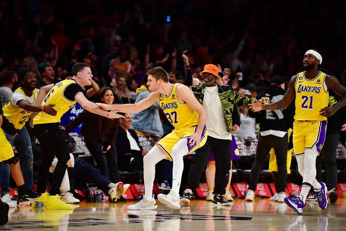 Los Angeles Lakers forward Matt Ryan (No. 37) reacting with fans after scoring a three-point basket to send the game against New Orleans Pelicans into overtime at Crypto.com Arena.
