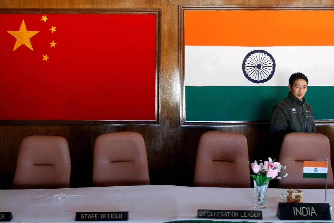 A man walks inside a conference room used for meetings between military commanders of China and India, at the Indian side of the Indo-China border at Bumla, in the northeastern Indian state of Arunachal Pradesh, November 11, 2009.  REUTERS/Adnan Abidi/File Photo