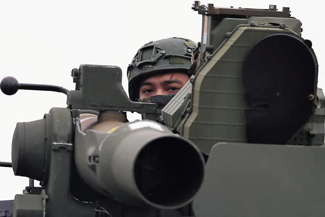 FILE PHOTO: A soldier stands on an M1167 TOW carrier vehicle at the Fangshan training grounds in Pingtung, Taiwan, August 26, 2024. REUTERS/Ann Wang/File Photo