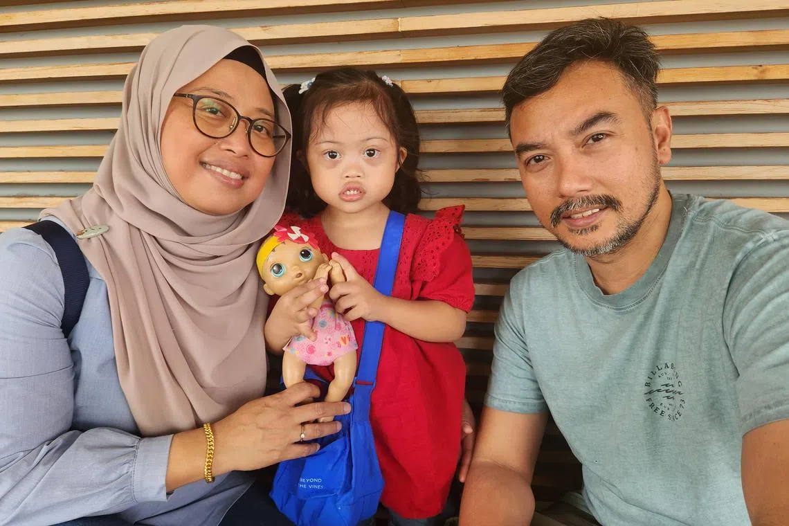 Myra Aqisha Mahadir (centre), who has Down syndrome, is also a cancer survivor. 